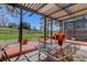 Back patio features a wood pergola and a glass table, perfect for outdoor dining at 7420 Windwood Way, Parker, CO 80134