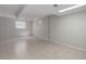 Unfinished basement features tiled floor, neutral walls, and natural light at 7420 Windwood Way, Parker, CO 80134