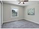 Neutral bedroom featuring a large window with a scenic view and a ceiling fan at 7420 Windwood Way, Parker, CO 80134