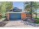Charming two-story home with brick and blue siding and attached garage at 7420 Windwood Way, Parker, CO 80134