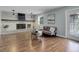 Cozy living room features a fireplace, hardwood floors and a comfortable seating area at 7420 Windwood Way, Parker, CO 80134