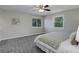 Bright main bedroom features a ceiling fan, dual windows, and neutral carpet at 7420 Windwood Way, Parker, CO 80134