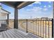 Deck offers exterior views with sleek black railings and wood flooring at 6824 Huddersfield Ln, Castle Pines, CO 80108