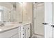 Bathroom showcasing double vanity, white cabinets and a glass-enclosed shower at 6824 Huddersfield Ln, Castle Pines, CO 80108