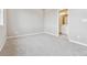 Bedroom featuring light gray walls and carpet along with a bathroom at 6824 Huddersfield Ln, Castle Pines, CO 80108