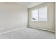 Bedroom featuring a large window, light gray walls and light gray carpet at 6824 Huddersfield Ln, Castle Pines, CO 80108