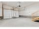 Spacious garage with ample room for parking and storage and stairs for access at 6824 Huddersfield Ln, Castle Pines, CO 80108