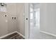 Neutral hallway with carpeted floor leading to other rooms in the home at 6824 Huddersfield Ln, Castle Pines, CO 80108