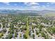An aerial view of the home's neighborhood and its tree-lined streets at 9015 W Tanforan Dr, Littleton, CO 80123