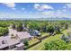An aerial view showcasing the home's backyard and its proximity to the mountains at 9015 W Tanforan Dr, Littleton, CO 80123