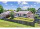 Aerial view of the home, showcasing the backyard, deck, shed, and neighborhood at 9015 W Tanforan Dr, Littleton, CO 80123