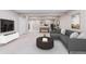 Finished basement features a cozy seating area and foosball table at 9015 W Tanforan Dr, Littleton, CO 80123