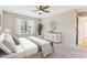 Serene bedroom featuring a ceiling fan, bright window, and modern furniture at 9015 W Tanforan Dr, Littleton, CO 80123