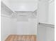 Walk-in closet with neutral carpet, shelving, and hanging rods at 9015 W Tanforan Dr, Littleton, CO 80123