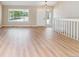 Inviting foyer showcasing light wood floors and bright natural light at 9015 W Tanforan Dr, Littleton, CO 80123
