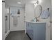 Basement bathroom with a modern vanity and walk-in shower at 5965 W Quarles Dr, Littleton, CO 80128