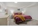 Spacious basement bedroom with plush bedding and light decor at 5965 W Quarles Dr, Littleton, CO 80128