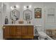 Modern bathroom with double vanity and hexagon tile floor at 5965 W Quarles Dr, Littleton, CO 80128