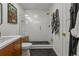 Clean bathroom with walk-in shower and hexagon tile floor at 5965 W Quarles Dr, Littleton, CO 80128