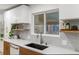 Modern kitchen sink and countertop with geometric backsplash at 5965 W Quarles Dr, Littleton, CO 80128