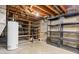 Unfinished basement providing ample storage, with exposed utilities and shelving at 9115 W 5Th Ave, Lakewood, CO 80226