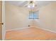 Bright bedroom featuring a ceiling fan, window, and hardwood floors at 9115 W 5Th Ave, Lakewood, CO 80226