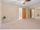 Bedroom with neutral carpet and mirrored closet at 9115 W 5Th Ave, Lakewood, CO 80226