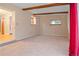 Spacious living room with carpet, beam and large window for lots of light at 9115 W 5Th Ave, Lakewood, CO 80226