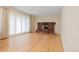 Living room with hardwood floors, brick fireplace, and natural light at 9115 W 5Th Ave, Lakewood, CO 80226