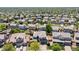 A picturesque aerial view showcases this home nestled within a vibrant neighborhood at 2509 S Bahama Way, Aurora, CO 80013