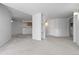 Open basement with neutral carpet and paint, offering lots of space and access to other rooms at 2509 S Bahama Way, Aurora, CO 80013