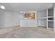 Open basement layout with a bar area and built-in shelving, perfect for entertaining guests at 2509 S Bahama Way, Aurora, CO 80013