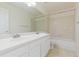 Well-lit bathroom with double sinks, a large mirror, and a shower-tub combination at 2509 S Bahama Way, Aurora, CO 80013