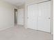 Bedroom with neutral carpet and closet with sliding doors at 2509 S Bahama Way, Aurora, CO 80013