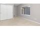 Bedroom with large window and double door closet at 2509 S Bahama Way, Aurora, CO 80013