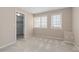Bright bedroom with neutral colors, large windows, and a closet for storage, creating a relaxing atmosphere at 2509 S Bahama Way, Aurora, CO 80013