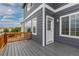 Inviting deck features gray wood, white trim, and natural railing that enhances this home's curb appeal at 2509 S Bahama Way, Aurora, CO 80013