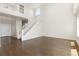 Open foyer featuring hardwood floors, a staircase with white railings, and lots of natural light at 2509 S Bahama Way, Aurora, CO 80013