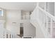Entry hall featuring a staircase and open banister at 2509 S Bahama Way, Aurora, CO 80013