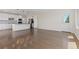 Bright, open-concept kitchen with stainless steel appliances and hardwood floors at 2509 S Bahama Way, Aurora, CO 80013