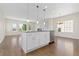 Kitchen island with white cabinets and stainless steel appliances at 2509 S Bahama Way, Aurora, CO 80013
