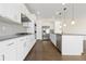 Kitchen with white cabinets, hardwood floors and stainless steel appliances at 2509 S Bahama Way, Aurora, CO 80013