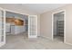Open concept living area that looks into the kitchen with access to the closet, perfect for everyday living at 2509 S Bahama Way, Aurora, CO 80013