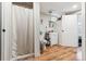 Functional bathroom with a walk-in shower, white vanity, and light wood flooring at 5384 Olde Stage Rd, Boulder, CO 80302