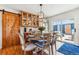 Dining room featuring wood table and chairs, a sliding door and wood floors at 5384 Olde Stage Rd, Boulder, CO 80302