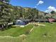 Beautiful home exterior with a large, well-maintained yard and mature trees against a mountain backdrop at 5384 Olde Stage Rd, Boulder, CO 80302