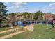 Exterior view of a blue home with two structures, landscaping, and a stone walkway at 5384 Olde Stage Rd, Boulder, CO 80302
