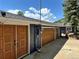 Exterior shot showcasing the garages and additional parking space, blending functionality with curb appeal at 5384 Olde Stage Rd, Boulder, CO 80302