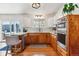Bright kitchen featuring wood cabinets, modern appliances, and a sliding glass door to the outdoor area at 5384 Olde Stage Rd, Boulder, CO 80302