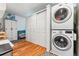 Functional laundry area with stacked washer and dryer units and ample storage space at 5384 Olde Stage Rd, Boulder, CO 80302